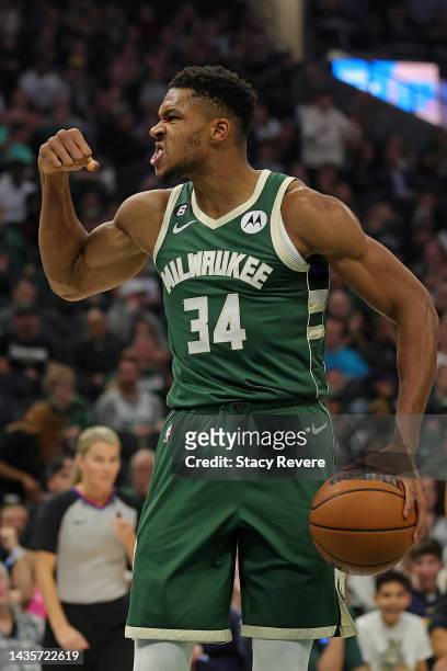 Giannis Antetokounmpo of the Milwaukee Bucks reacts to a basket during the first half of a game against the Houston Rockets at Fiserv Forum on...