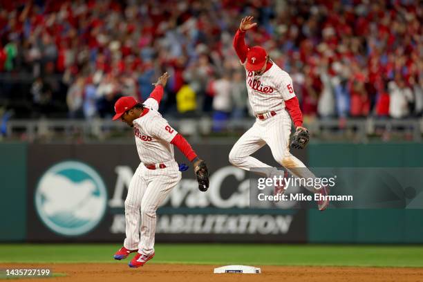 Jean Segura and Bryson Stott of the Philadelphia Phillies celebrate their 10-6 win against the San Diego Padres in game four of the National League...