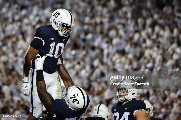 Nicholas Singleton of the Penn State Nittany Lions celebrates with Olumuyiwa Fashanu after scoring a touchdown against the Minnesota Golden Gophers...