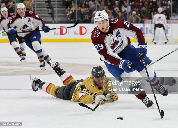 Alec Martinez of the Vegas Golden Knights dives as he tries to stop Nathan MacKinnon of the Colorado Avalanche in the third period of their game at...