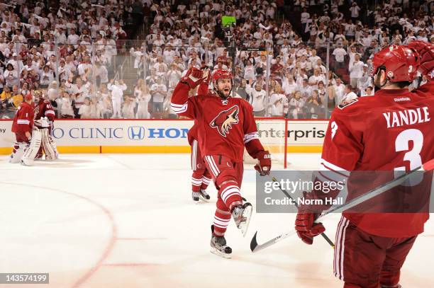 Keith Yandle and Adrian Aucoin of the Phoenix Coyotes celebrate after an overtime victory against the Nashville Predators in Game One of the Western...