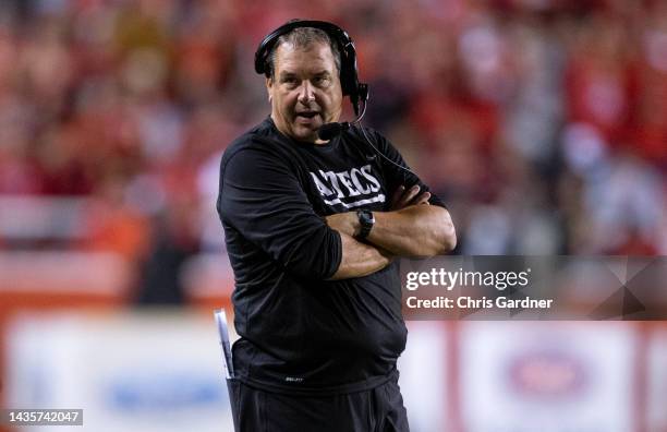 Brady Hoke head coach of the San Diego State Aztecs talks in his head set during the first half of their game against the Utah Utes September 17,...