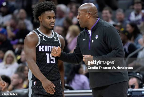 Head coach Mike Brown of the Sacramento Kings talks with his player Davion Mitchell against the LA Clippers at the end of the third quarter of an NBA...