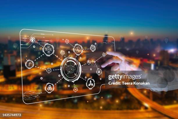 close-up of hands touching screen virtual internet connection concept of new technology, big data and business process strategy with night vision in the background. - center for asian american media stock pictures, royalty-free photos & images