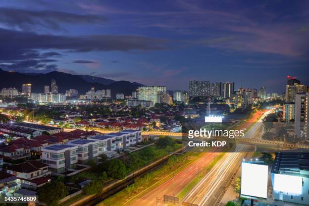 cityscape and real estate for housing development of penang city, malaysia - zonne eiland stockfoto's en -beelden