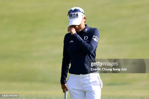 Na-yeon Choi of South Korea sheds tears after holing out on the 9th green as she is retiring from LPGA tournaments during the final round of the BMW...