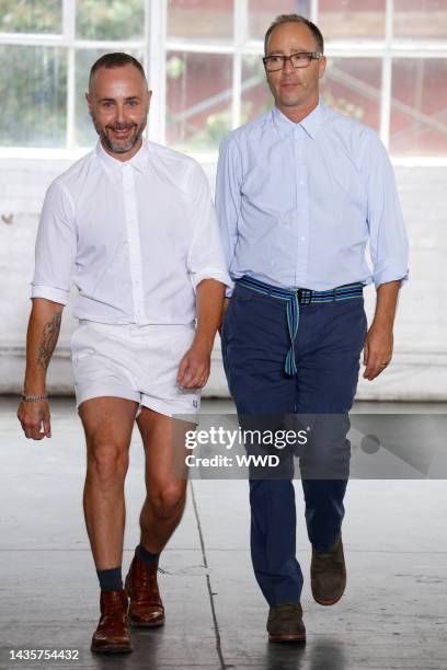 Fashion designers Steven Cox and Daniel Silver on the runway after their Duckie Brown spring 2013 show at Industria Studio.