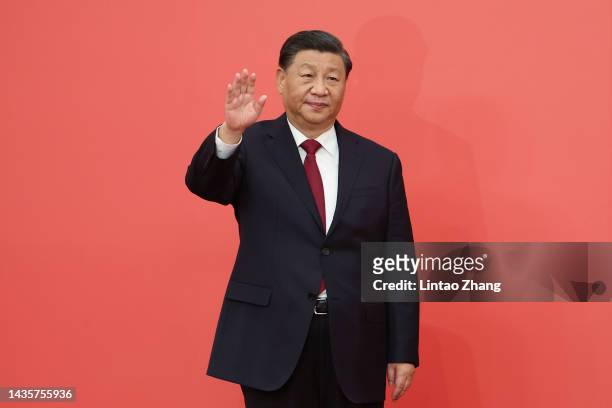 Chinese President Xi Jinping waves during the meeting between members of the standing committee of the Political Bureau of the 20th CPC Central...