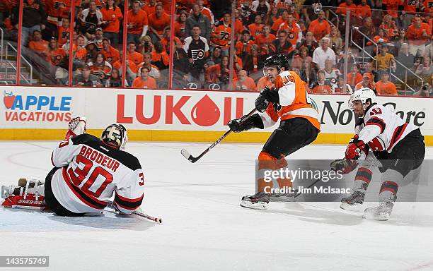 Danny Briere of the Philadelphia Flyers scores a second period goal past Martin Brodeur of the New Jersey Devils in Game One of the Eastern...