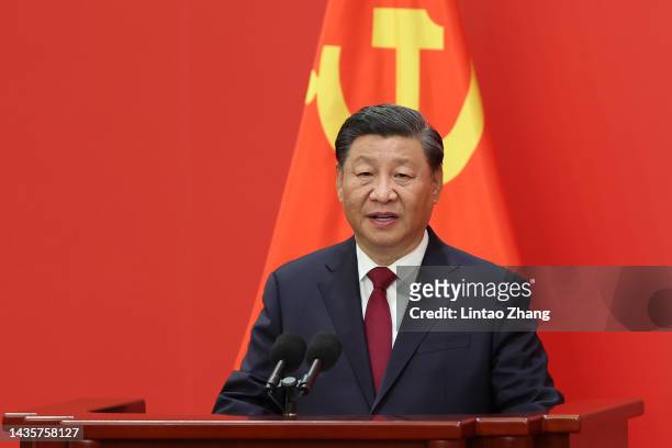 Chinese President Xi Jinping waves during the meeting between members of the standing committee of the Political Bureau of the 20th CPC Central...