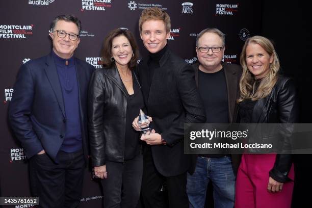 Eddie Redmayne holds his 2022 Performance of The Year Award and poses Stephen Colbert , Evie McGee-Colbert , Tom Hall and Brooke Wilson at a...