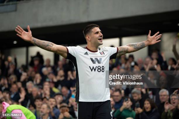 Aleksandar Mitrovic of Fulham celebrates scoring his teams second goal in the Premier League match between Fulham FC and Aston Villa at Craven...