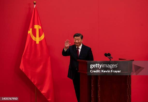 General Secretary and Chinese President Xi Jinping waves as he leaves after speaking at a press event with Members of the new Standing Committee of...