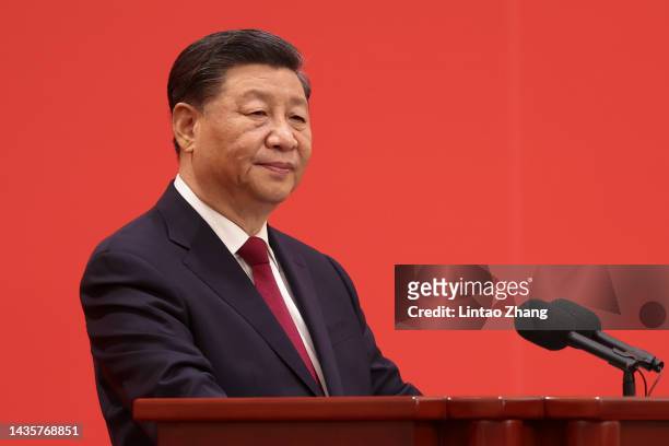 Chinese President Xi Jinping speaks at the podium during the meeting between members of the standing committee of the Political Bureau of the 20th...