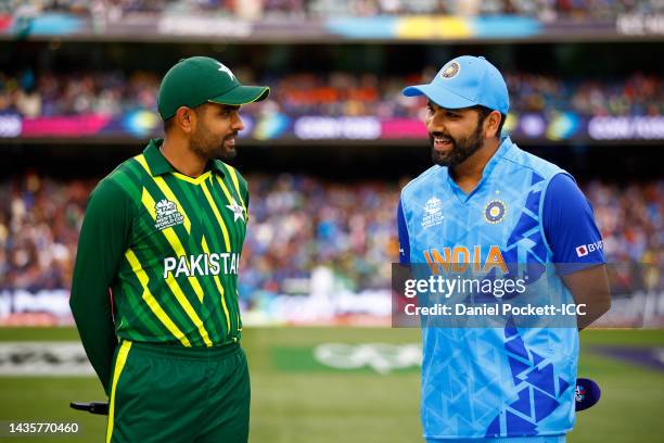 The team captains Babar Azam of Pakistan and Rohit Sharma of India speak before the ICC Men's T20 World Cup match between India and Pakistan at...