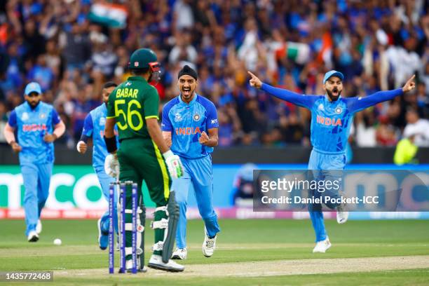 Arshdeep Singh of India celebrates the wicket of Babar Azam of Pakistan during the ICC Men's T20 World Cup match between India and Pakistan at...