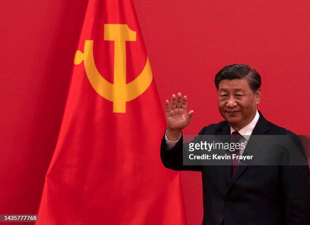 General Secretary and Chinese President Xi Jinping waves as he leaves after speaking at a press event with Members of the new Standing Committee of...