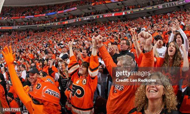 Fans of the Philadelphia Flyers celebrate a third period goal against the New Jersey Devils in Game One of the Eastern Conference Semifinals during...