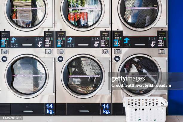 front view of coin operated laundry equipment - laundromat stock pictures, royalty-free photos & images