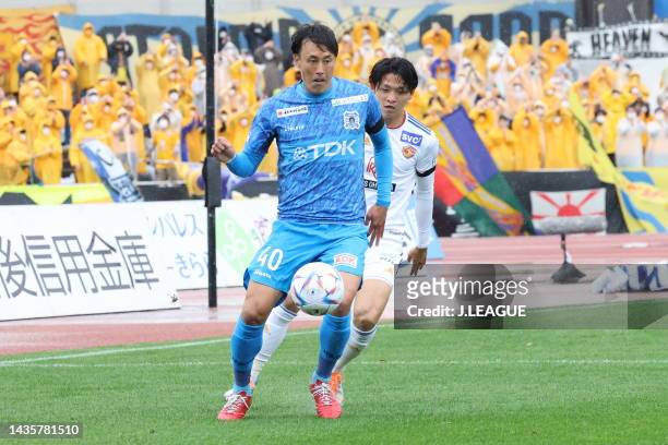 Shota AOKI of Blaublitz Akita and Naoya FUKUMORI of Vegalta Sendai battle for the ball during the J.LEAGUE Meiji Yasuda J2 42nd Sec. Match between...