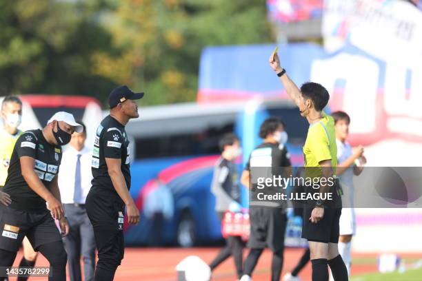 Referee Toru KAKINUMA shows an yellow card to Head coach Yutaka AKITA of Iwate Grulla Morioka during the J.LEAGUE Meiji Yasuda J2 42nd Sec. Match...