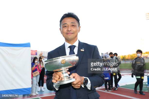 Head coach Tatsuma YOSHIDA of Ventforet Kofu holds the emperor cup after the J.LEAGUE Meiji Yasuda J2 42nd Sec. Match between Ventforet Kofu and...
