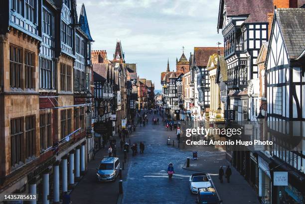 view of the main street of chester, uk. - chester stock-fotos und bilder