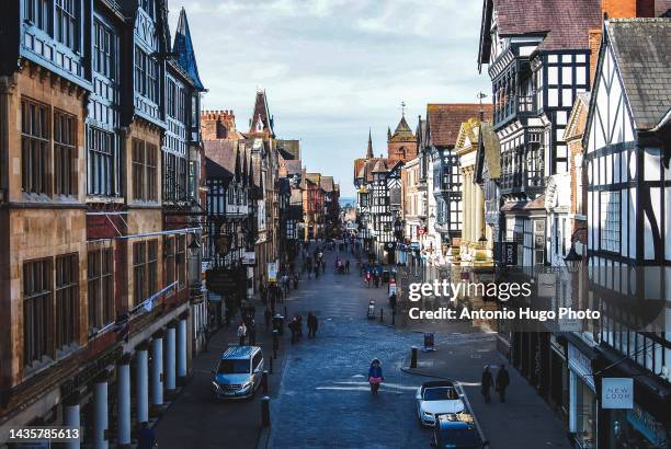 view of the main street of chester, uk. - chester england fotografías e imágenes de stock