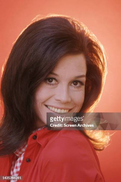 Mary Tyler Moore Striking smiling portrait in red jacket circa 1970.