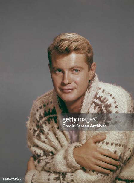 Troy Donahue classic studio publicity portrait wearing large sweater circa 1963.