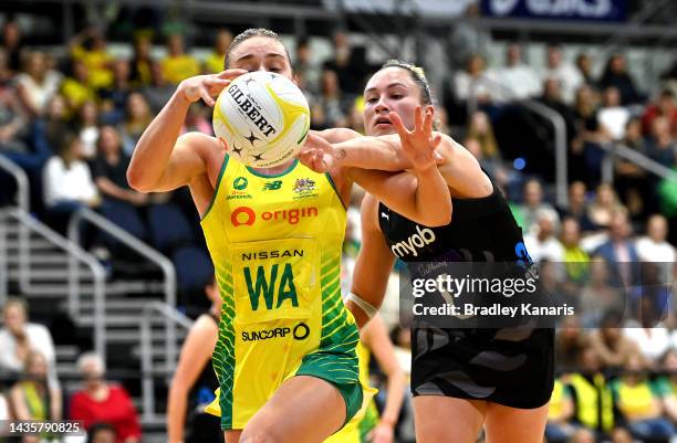 Liz Watson of Australia and Whitney Souness of New Zealand challenge for the ball during the Constellation Cup match between the Australia Diamonds...