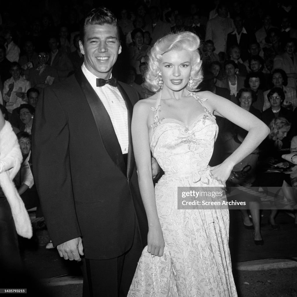 Jayne Mansfield and husband Mickey Hargitay posing for photographers