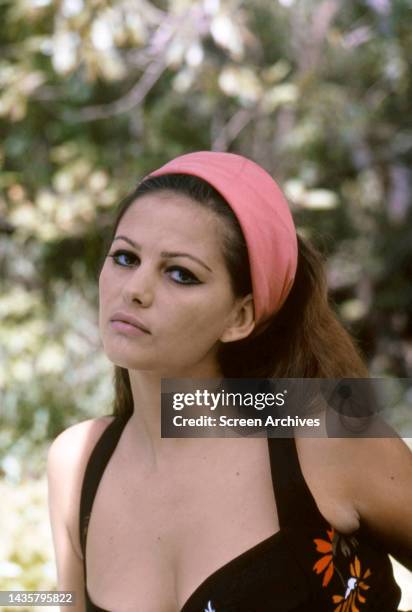Claudia Cardinale Italian actress pictured in low cut dress and pink head scarf for publicity pose circa 1967.