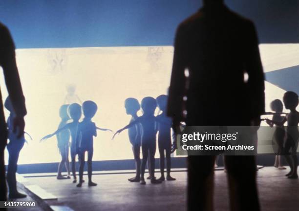 Close Encounters of the Third Kind scene of Extra-terrestrial alien greys emerging from the mothership in Steven Spielberg's 1977 sci-fi classic.