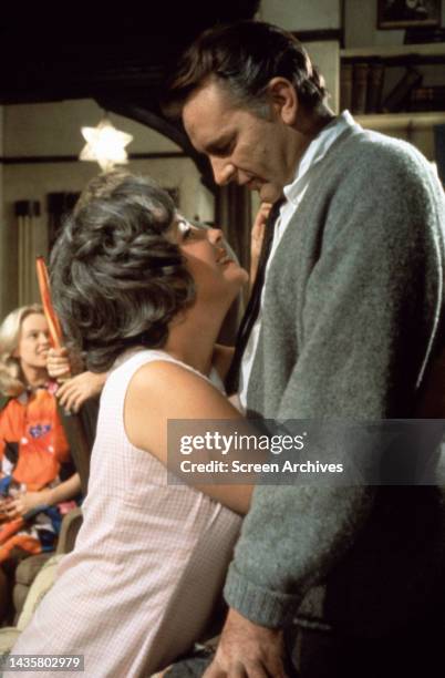 Who's Afraid of Virginia Woolf? Elizabeth Taylor hugs Richard Burton with Sandy Dennis in background during filming the 1966 movie.