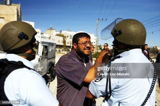 Israeli far-right activist Itamar Ben-Gvir in a confontation with police officers during a demonstration in Hebron, West Bank, 2nd December 2008....