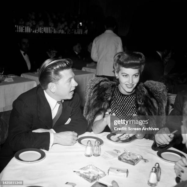 Ava Gardner and Mickey Rooney share romantic dinner in Hollywood circa 1942.