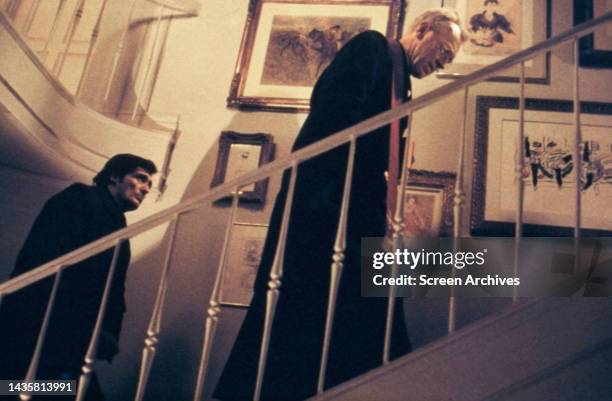 The Exorcist Jason Miller and Max Von Sydow climb staircase in a scene from the 1973 movie.