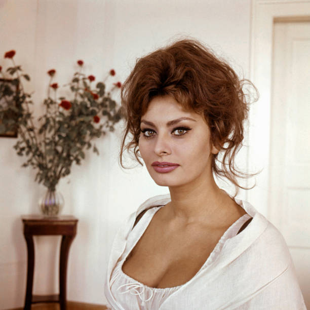 Sophia Loren sultry glamour portrait in low cut white dress circa 1960.