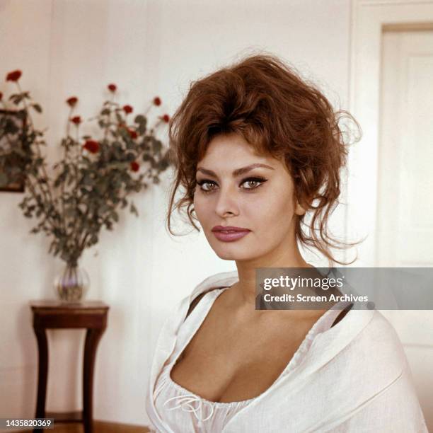 Sophia Loren sultry glamour portrait in low cut white dress circa 1960.