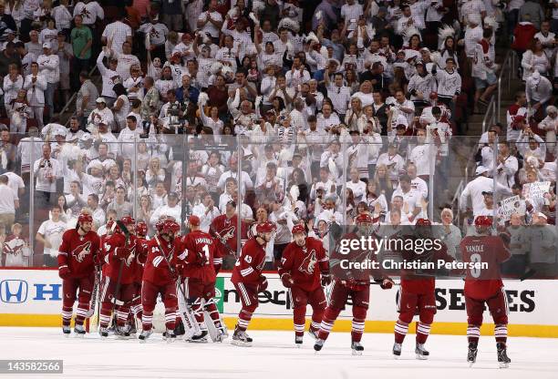 Mikkel Boedker of the Phoenix Coyotes high-fives Keith Yandle as the Coyotes celebrate defeating the Nashville Predators in Game Two of the Western...