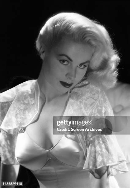 Joi Lansing stunning glamour portrait of the voluptuous blonde bombshell actress, model and singer.