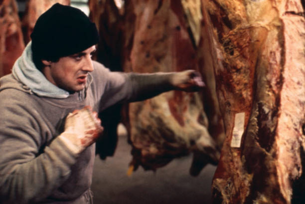 Rocky Sylvester Stallone punching meat in training in a scene from the classic 1976 movie.