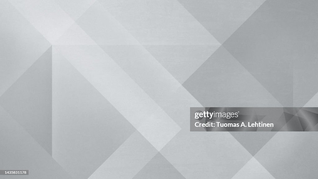 Abstract gray diagonal shapes and rectangles.