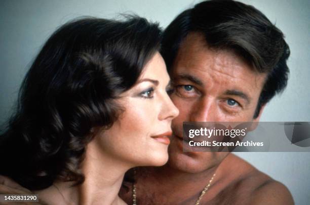 Natalie Wood and Robert Wagner pose for a sensual portrait bare-shouldered circa 1972.