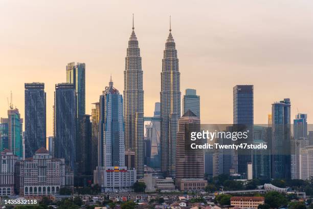 kuala lumpur cbd and petronas twin towers view in morning - kuala lumpur twin tower stock pictures, royalty-free photos & images