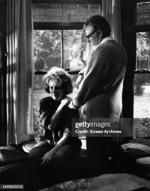 Richard Burton comforting Elizabeth Taylor in a scene from the 1966 film Who's Afraid Of Virginia Woolf?.