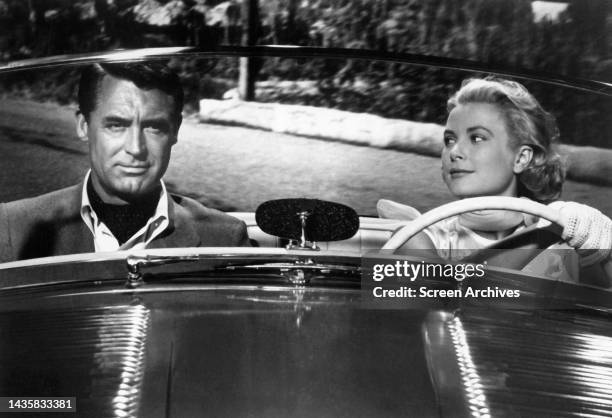 To Catch A Thief Grace Kelly looking over at Cary Grant as she drives convertible car down Monaco streets in a scene from the classic 1955 Alfred...