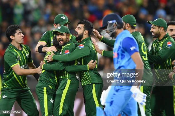 Pakistan players celebrate running out Axar Patel of India during the ICC Men's T20 World Cup match between India and Pakistan at Melbourne Cricket...