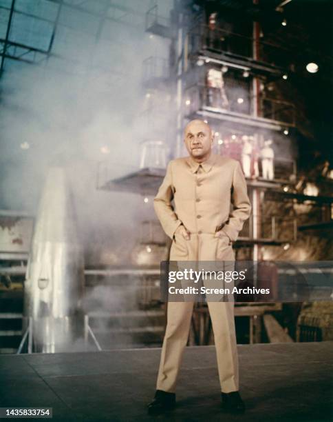 You Only Live Twice Donald Pleasence as James Bond villain Blofeld standing in front of rocket from the classic 1967 movie.